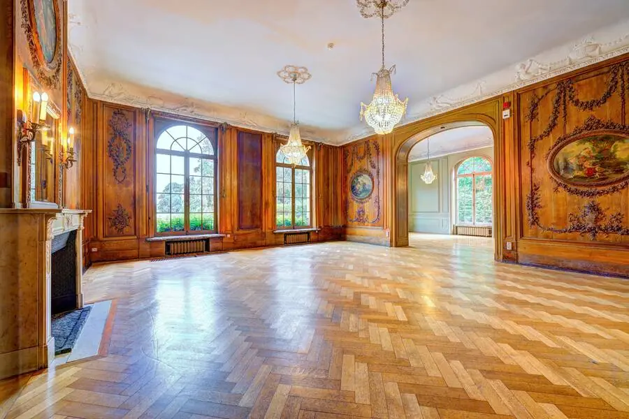 Drawing room with carved panelling and parquet flooring